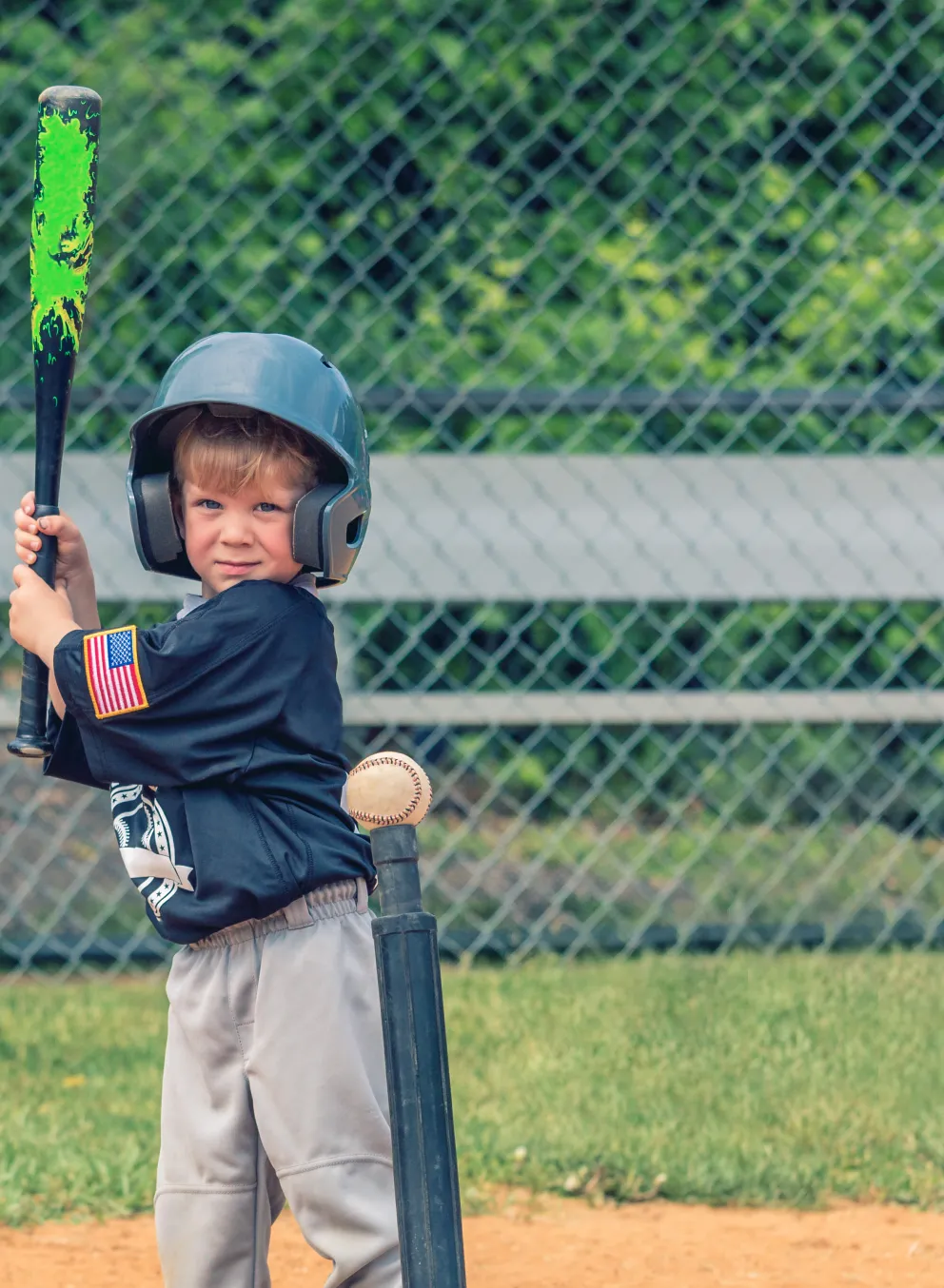 Child playing T-Ball